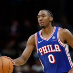 Philadelphia 76ers guard Tyrese Maxey (0) brings the ball up court against the Chicago Bulls during the second half at United Center.