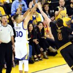 Golden State Warriors guard Stephen Curry (30) shoots the ball against Cleveland Cavaliers forward Kevin Love (0) during the second quarter in game five of the NBA Finals at Oracle Arena.