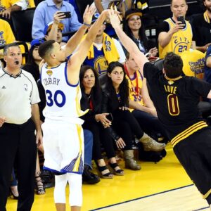 Golden State Warriors guard Stephen Curry (30) shoots the ball against Cleveland Cavaliers forward Kevin Love (0) during the second quarter in game five of the NBA Finals at Oracle Arena.