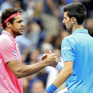 Jo-Wilfried Tsonga of France shakes hands with Novak Djokovic of Serbia after the match on day nine of the 2016 U.S. Open
