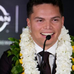 Oregon Ducks quarterback Dillon Gabriel speaks on stage during a press conference before the 2024 Heisman Trophy Presentation.