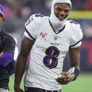 Baltimore Ravens quarterback Lamar Jackson (8) smiles during the fourth quarter against the Houston Texans at NRG Stadium.