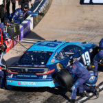NASCAR Cup Series driver Martin Truex Jr. (19) pit crew go to work during the Xfinity 500 at Martinsville Speedway.