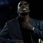 Chad Johnson has a commemorative jacket put on him after being announced as as being a Bengals Ring of Champions inductee at halftime of the NFL game between the Cincinnati Bengals and Los Angeles Rams at Paycor Stadium in Cincinnati.