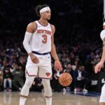 New York Knicks guard Josh Hart (3) sets the play while being defended by Charlotte Hornets guard Seth Curry (30) during the second half at Madison Square Garden