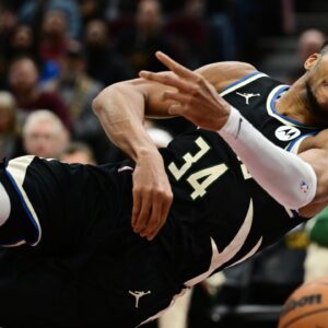 Milwaukee Bucks forward Giannis Antetokounmpo (34) tries to save the ball from going out of bounds during the first half against the Cleveland Cavaliers at Rocket Mortgage FieldHouse