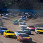 NASCAR Cup Series driver Martin Truex Jr leads Joey Logano (22) at the green flag to start the NASCAR Cup Series Championship race at Phoenix Raceway.