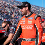 NASCAR Cup Series driver Chase Briscoe (14) laughs with his crew as they move up in line during cup qualifying at Martinsville Speedway.