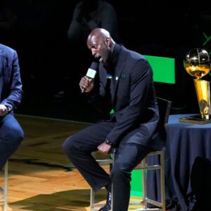 Basketball Hall of Fame and former Boston Celtic, Kevin Garnett speaks with Brian Scalabrine during the number retirement ceremony after the game between the Boston Celtics the Dallas Mavericks at TD Garden.
