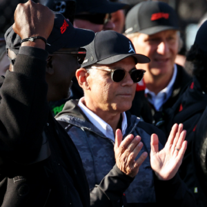 NASCAR team owner Michael Jordan and Film producer Curtis Polk celebrate in victory lane after the GEICO 500 at Talladega Superspeedway.