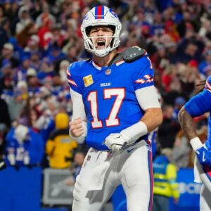 Buffalo Bills quarterback Josh Allen (17) reacts to scoring a touchdown against the Kansas City Chiefs during the second half at Highmark Stadium.