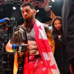 Ilia Topuria celebrates his championship victory against Alexander Volkanovski during UFC 298 at Honda Center.