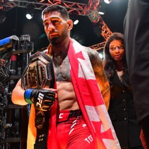 Ilia Topuria celebrates his championship victory against Alexander Volkanovski during UFC 298 at Honda Center.