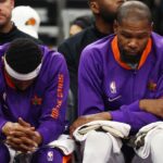 Phoenix Suns guard Bradley Beal (left) and forward Kevin Durant react on the bench against the Indiana Pacers at Footprint Center.