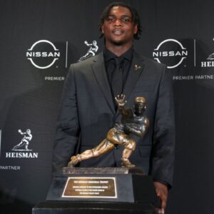 Miami Hurricanes quarterback Cam Ward poses for a photo during a press conference before the 2024 Heisman Trophy Presentation.