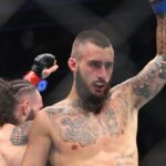 Charles Jourdain (blue gloves) reacts after fight against Shane Burgos (red gloves) during UFC Fight Night at UBS Arena.
