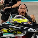 Lewis Hamilton of Great Britain and Mercedes reacts after performing donuts on track for his final race with Mercedes during the F1 Grand Prix of Abu Dhabi at Yas Marina Circuit