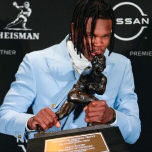 Colorado Buffaloes wide receiver/cornerback Travis Hunter poses for a photo after winning the Heisman Trophy award during the 2024 Heisman Trophy Presentation.
