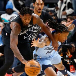 Brooklyn Nets forward Dorian Finney-Smith (28) and Memphis Grizzlies guard Ja Morant (12) battle for a loose ball during the first quarter at FedExForum.