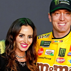 NASCAR Cup Series driver Kyle Busch (18) celebrates after winning the NASCAR Series Cup Championship with his wife Samantha Busch after the Ford EcoBoost 400 at Homestead-Miami Speedway.