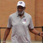 Bobby Bell arrives on the red carpet during the Pro Football Hall of Fame Class of 2022 Enshrinement at Tom Benson Hall of Fame Stadium.