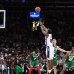 Philadelphia 76ers guard Tyrese Maxey (0) shoots for three points against the Boston Celtics during the second half at TD Garden