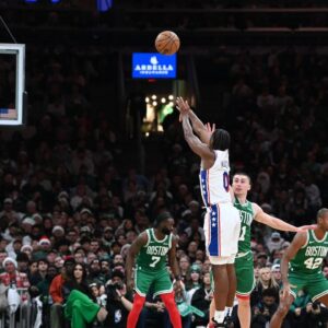 Philadelphia 76ers guard Tyrese Maxey (0) shoots for three points against the Boston Celtics during the second half at TD Garden