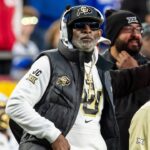 Colorado head coach Deion Sanders watches the run of play during the 3rd quarter between the Kansas Jayhawks and the Colorado Buffaloes at GEHA Field at Arrowhead Stadium.