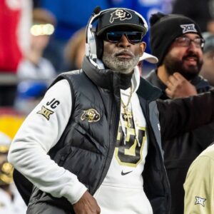 Colorado head coach Deion Sanders watches the run of play during the 3rd quarter between the Kansas Jayhawks and the Colorado Buffaloes at GEHA Field at Arrowhead Stadium.