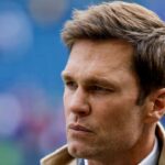 FOX commentator Tom Brady stands on the sideline before a game between the Seattle Seahawks and Buffalo Bills at Lumen Field.