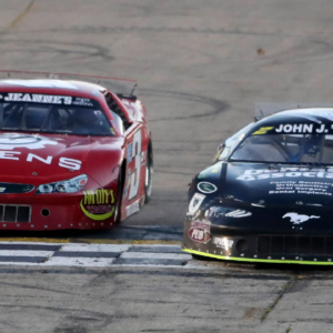 Sawyer Effertz, right, edges out Taylor Vandermoss in a Super Late Model qualifier during a night of championship racing including the Blue Race, the final leg of the Red, White and Blue State Championship Series