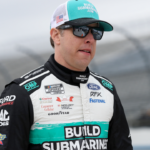 NASCAR Cup Series driver Brad Keselowski walks on pit road during practice and qualifying for the Wurth 400 at Dover Motor Speedway.