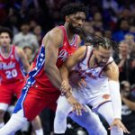 Philadelphia 76ers center Joel Embiid (21) defends against New York Knicks guard Jalen Brunson (11) during the third quarter at Wells Fargo Center.