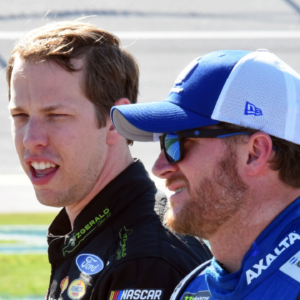 NASCAR Cup Series driver Brad Keselowski (2) talks with Dale Earnhardt Jr. (88) during qualifying for the GEICO 500 at Talladega Superspeedway.
