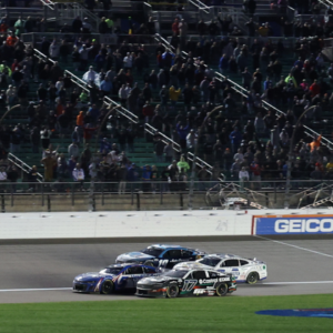 May 5, 2024; Kansas City, Kansas, USA; NASCAR Cup Series drivers Kyle Larson (5) and Chris Buescher (17) battle for the lead on the final lap off the Advent Health 400 at the Kansas Speedway. Mandatory Credit: Reese Strickland-Imagn Images