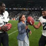 Sep 6, 2024; Sao Paulo, Brazil; Peacock sideline reporter Kaylee Hartung (center) interviews Philadelphia Eagles wide receiver A.J. Brown (11) and running back Saquon Barkley (26) after the 2024 NFL Sao Paolo Game at Neo Quimica Arena.
