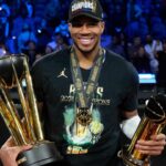 Milwaukee Bucks forward Giannis Antetokounmpo (34) celebrates with the most valuable player and championship trophies after winning the Emirates NBA Cup championship game against the Oklahoma City Thunder at T-Mobile Arena.