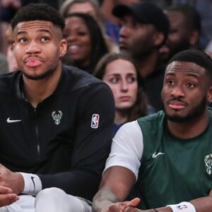 Milwaukee Bucks forward Giannis Antetokounmpo (l) and his brother Milwaukee Bucks forward Thanasis Antetokounmpo (r) watch the game from the bench in the fourth quarter against the New York Knicks at Madison Square Garden