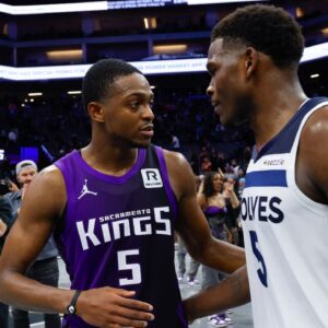 Sacramento Kings guard De'Aaron Fox (5) and Minnesota Timberwolves guard Anthony Edwards (5) meet after the game at Golden 1 Center.