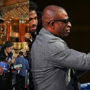 Cam Newton, Deion Sanders and Travis Hunter