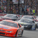 Racers make their way around the track during the start of the 56th Annual Snowball Derby at Five Flags Speedway Sunday, December 3, 2023.
