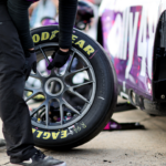 A crew member for NASCAR Cup Series driver Alex Bowman (48) puts a tire on the car during practice and qualifying for the Cook Out 400 at Richmond Raceway.
