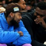 New Orleans Pelicans forward Zion Williamson (right) talks with forward Brandon Ingram (left) on the bench during the second half against the Memphis Grizzlies at FedExForum.