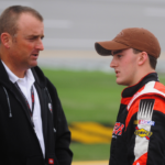NASCAR Camping World Truck Series driver Austin Dillon (right) talks with father Mike Dillon during qualifying for the Mountain Dew 250 at the Talladega Superspeedway.
