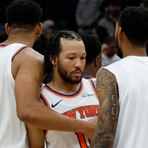 New York Knicks center Karl-Anthony Towns (32) hugs New York Knicks guard Jalen Brunson (11) after their game against the Washington Wizards at Capital One Arena.