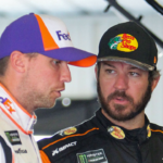 NASCAR Cup Series driver Martin Truex Jr (right) talks with driver Denny Hamlin (left) during practice for the Gander RV 400 at Pocono Raceway.