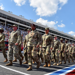 May 26, 2019; Concord, NC, USA; Service men and women of the U.S. Army March on the track prior to the Coca-Cola 600 at Charlotte Motor Speedway. Mandatory Credit: Jasen Vinlove-Imagn Images