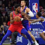 Lou Williams (R) and Joel Embiid (C)