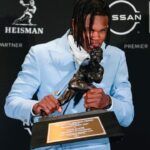 Colorado Buffaloes wide receiver/cornerback Travis Hunter poses for a photo after winning the Heisman Trophy award during the 2024 Heisman Trophy Presentation.