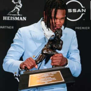 Colorado Buffaloes wide receiver/cornerback Travis Hunter poses for a photo after winning the Heisman Trophy award during the 2024 Heisman Trophy Presentation.